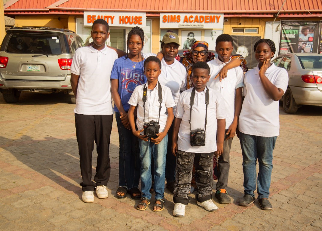 Photography students and instructors outside Sims Academy