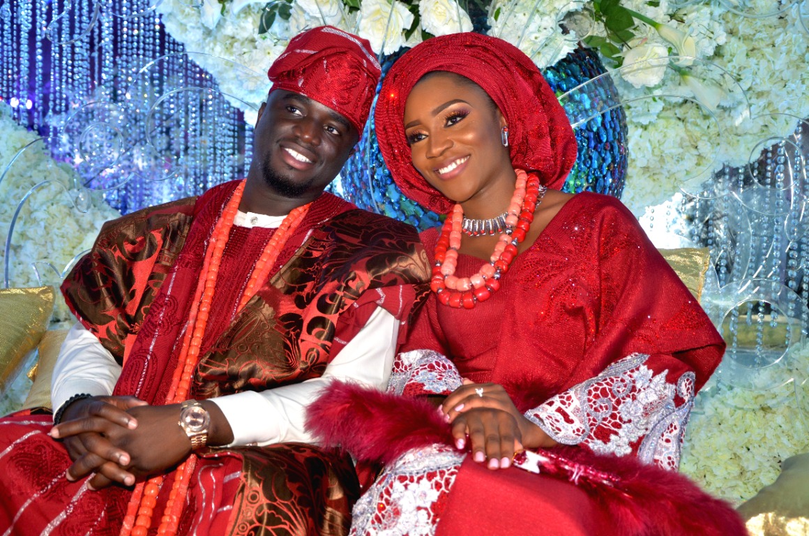 Couple in red traditional wedding attire